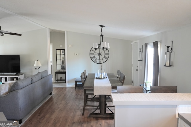 dining room with ceiling fan and dark hardwood / wood-style floors