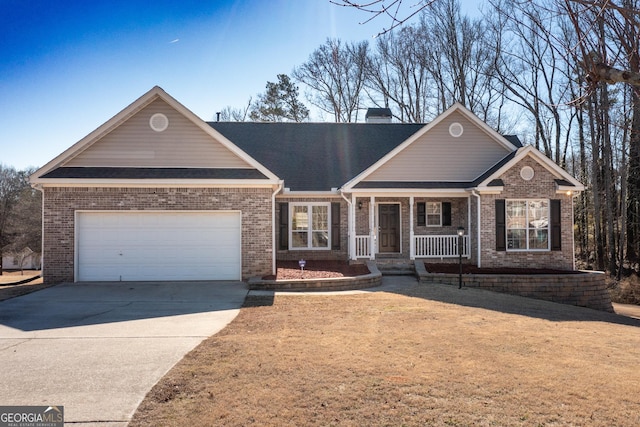 ranch-style home featuring a garage and covered porch