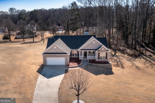 view of front of home featuring a garage and a porch