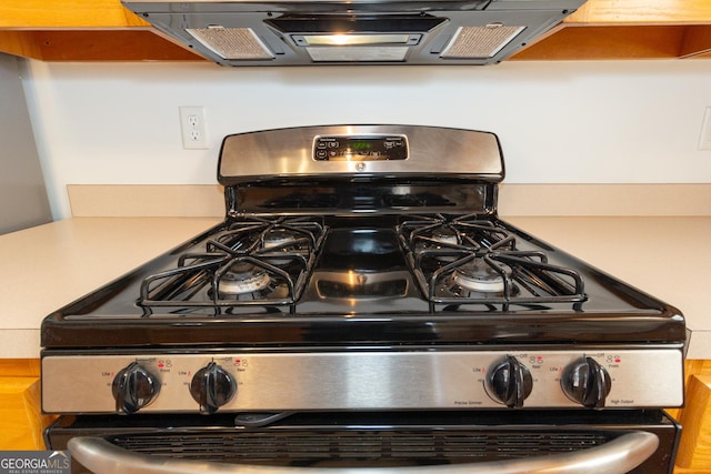 details featuring extractor fan and gas stove