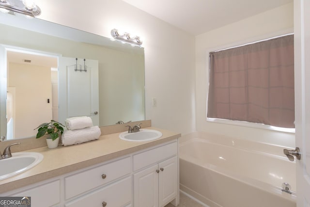 bathroom with vanity and a tub to relax in