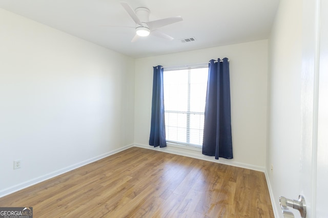 spare room with ceiling fan and light hardwood / wood-style floors