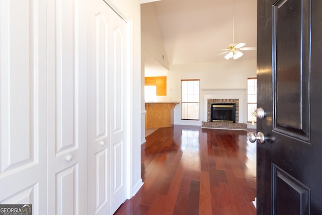 interior space with vaulted ceiling and dark hardwood / wood-style flooring