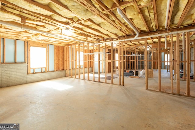 misc room with concrete flooring