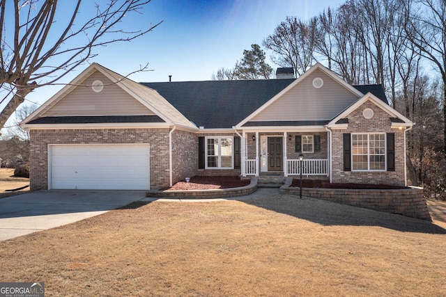 view of front of property featuring a garage and a porch