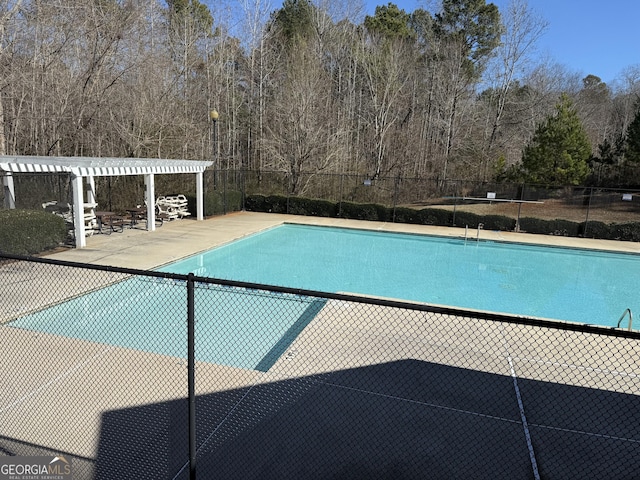 view of pool featuring a patio area and a pergola