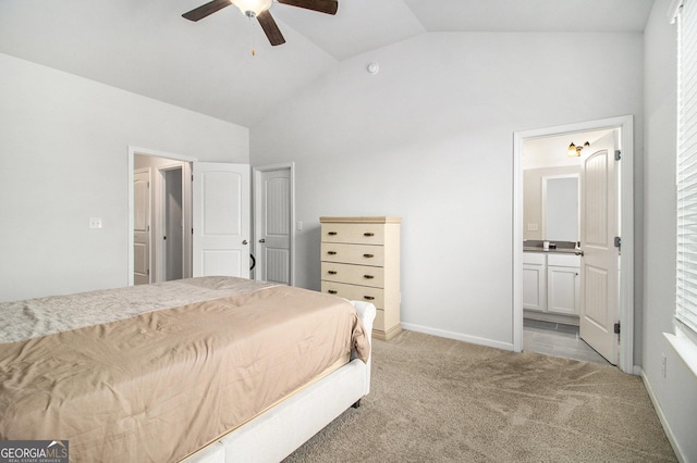 carpeted bedroom featuring ensuite bathroom, ceiling fan, and lofted ceiling