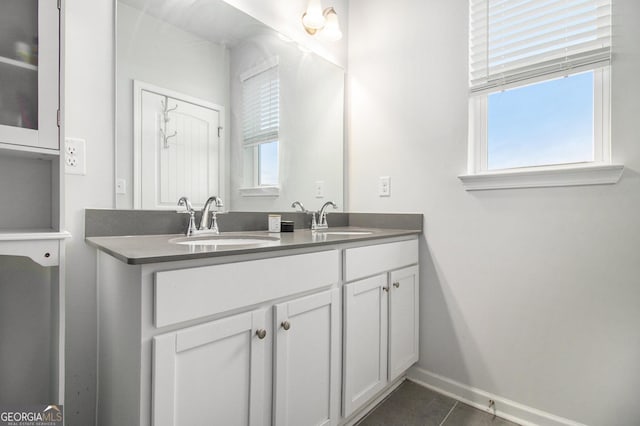 bathroom with vanity, tile patterned flooring, and plenty of natural light