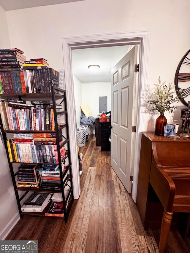 hall featuring wood-type flooring and electric panel