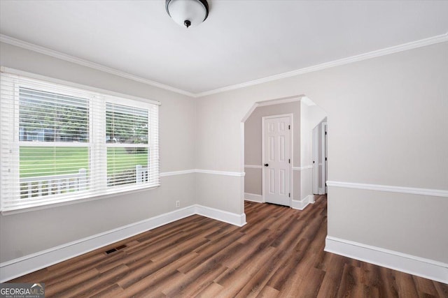 unfurnished room with dark hardwood / wood-style floors and ornamental molding