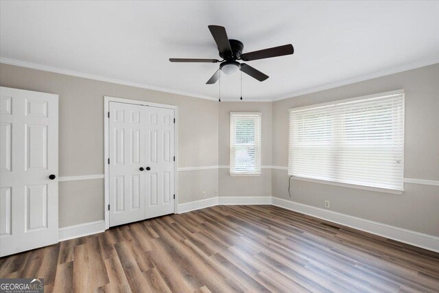 full bathroom with toilet, vanity, tile patterned floors,  shower combination, and ornamental molding