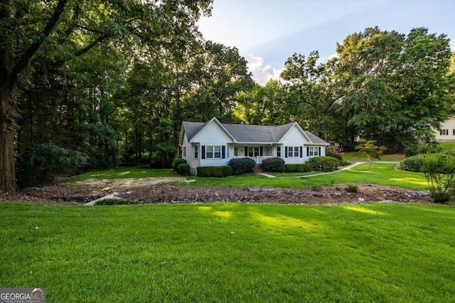 single story home with a front yard