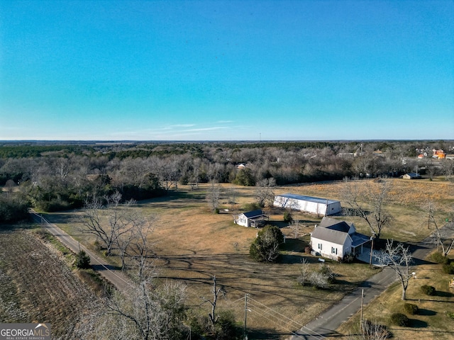 birds eye view of property with a rural view