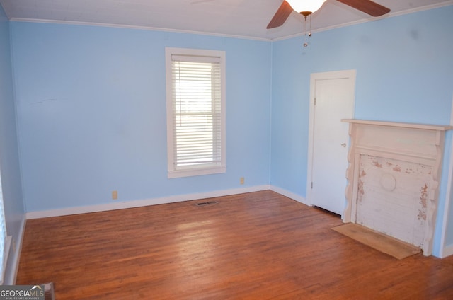 spare room with ceiling fan, crown molding, and hardwood / wood-style flooring