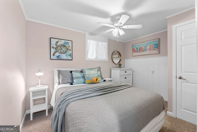 carpeted bedroom featuring ceiling fan and ornamental molding