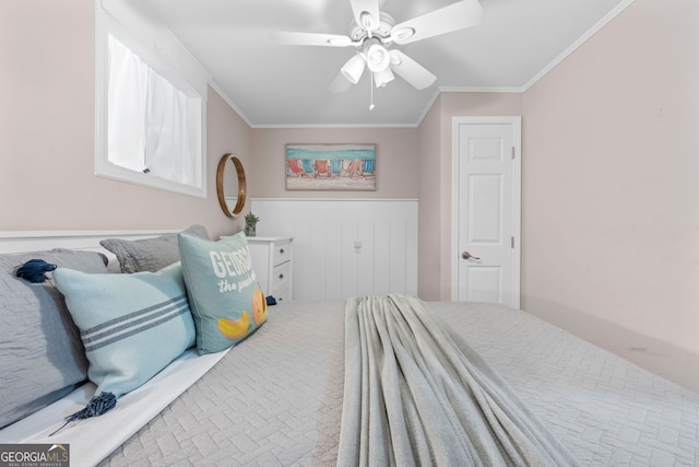 bedroom featuring ceiling fan and ornamental molding