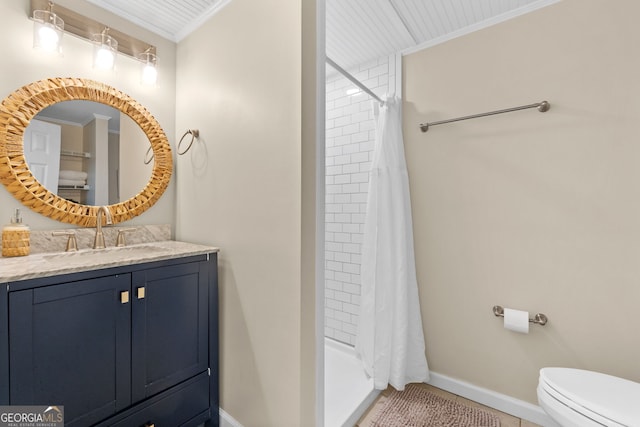 bathroom featuring walk in shower, vanity, toilet, and crown molding