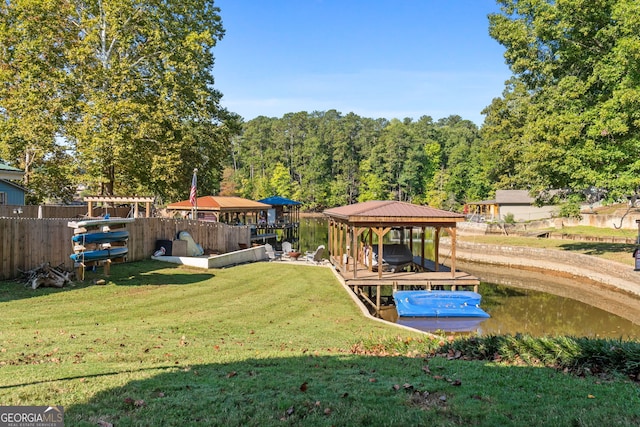 exterior space with a water view, a boat dock, and a yard