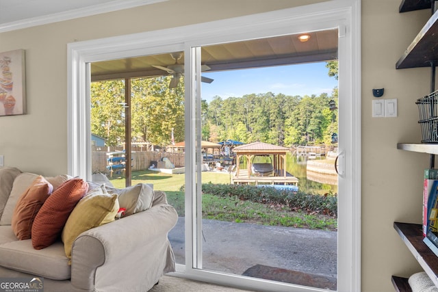 doorway to outside featuring ornamental molding