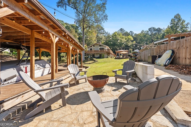 view of patio / terrace with a fire pit