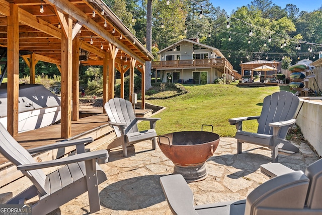 view of patio / terrace with an outdoor fire pit and a gazebo