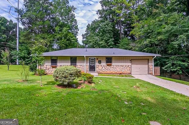 ranch-style home with a garage and a front lawn