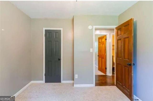 unfurnished bedroom with carpet