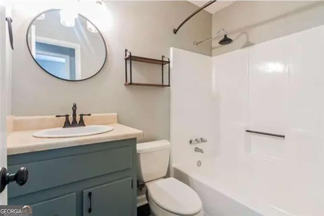 full bathroom featuring toilet, tub / shower combination, and vanity