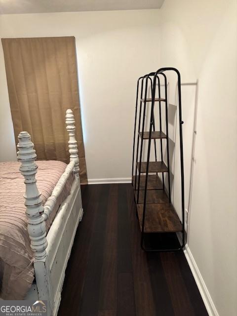 bedroom featuring dark hardwood / wood-style floors