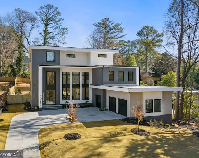 rear view of house with a garage