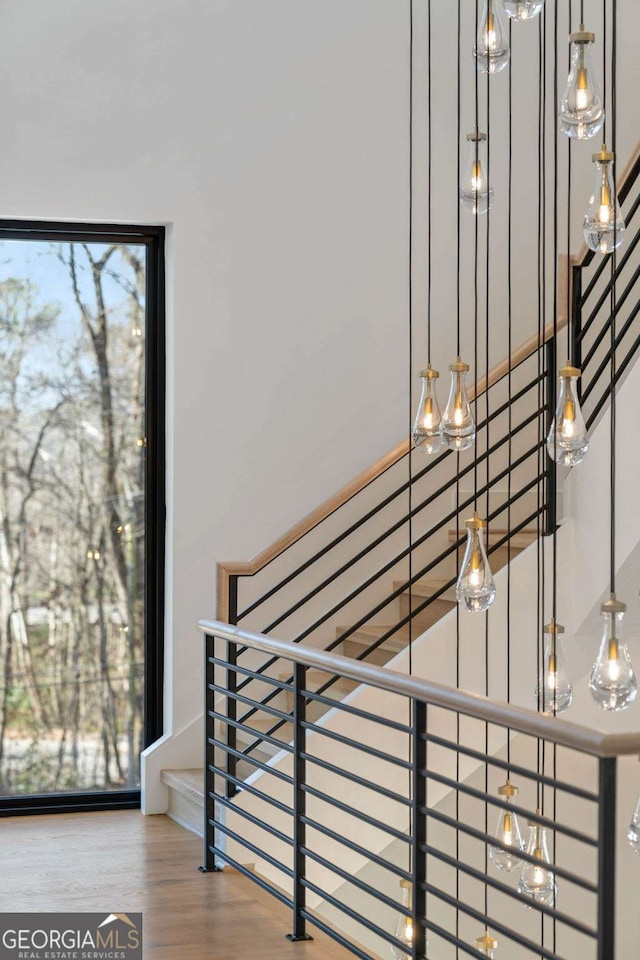 stairs featuring hardwood / wood-style flooring