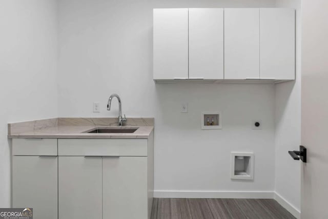 clothes washing area with cabinets, sink, hookup for an electric dryer, and washer hookup