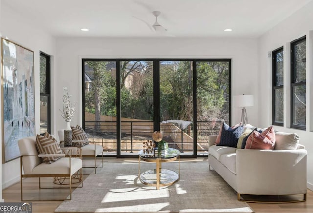 sunroom / solarium with ceiling fan and plenty of natural light