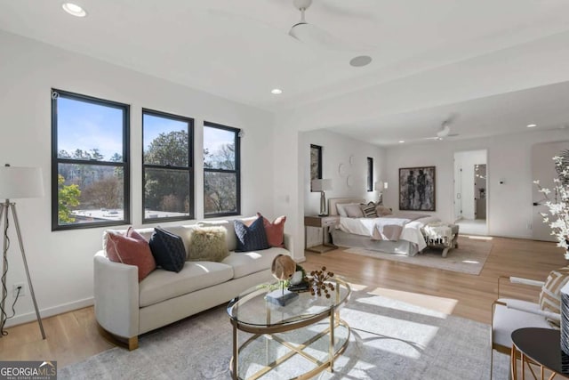 bedroom with light wood-type flooring and ceiling fan