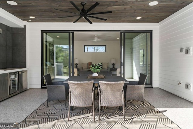 view of patio featuring ceiling fan and beverage cooler