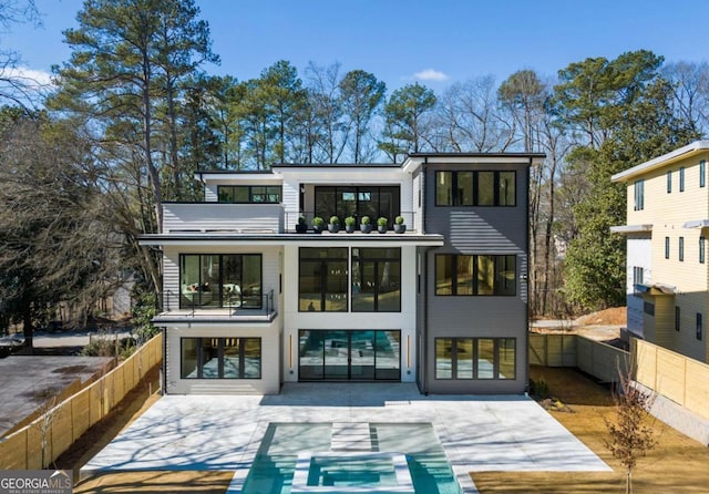 back of house with a balcony