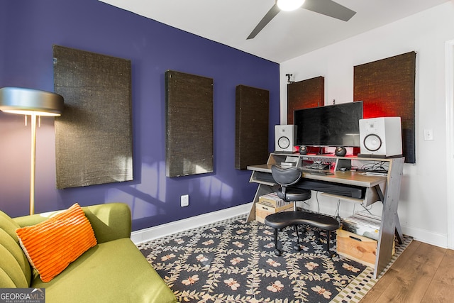 home office featuring hardwood / wood-style flooring and ceiling fan