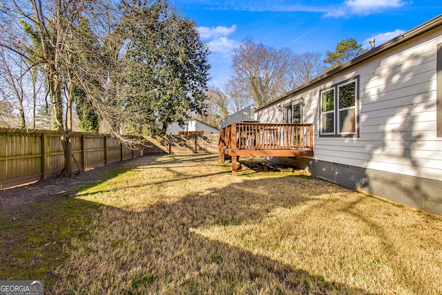 view of yard with a wooden deck