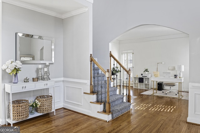 entryway featuring dark hardwood / wood-style flooring and crown molding