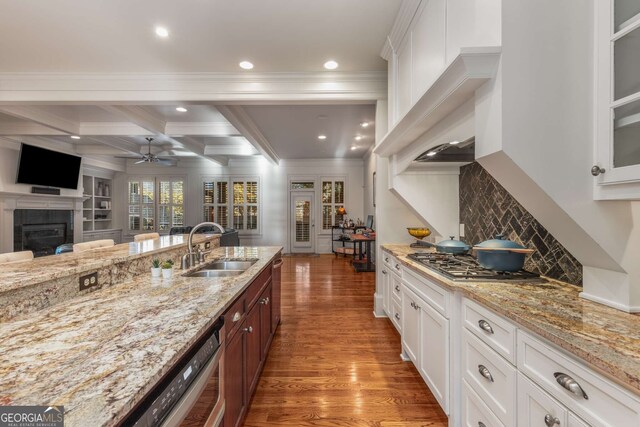 living room featuring hardwood / wood-style floors, beam ceiling, and coffered ceiling