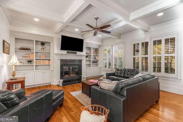 living room with ceiling fan, crown molding, and hardwood / wood-style floors