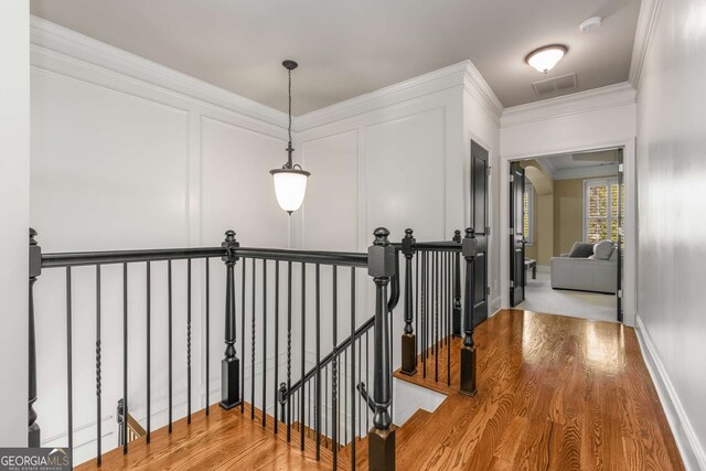 bedroom featuring ceiling fan, light carpet, and ornamental molding