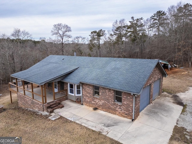 view of front facade with a porch and a garage