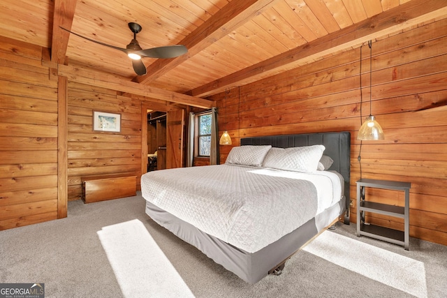 bedroom with wood walls, wooden ceiling, ceiling fan, light colored carpet, and beamed ceiling