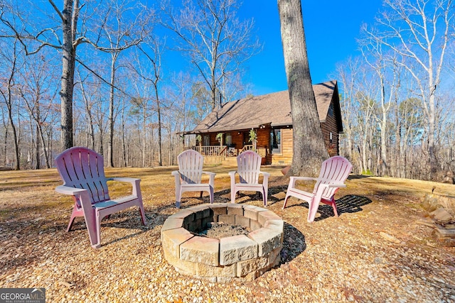 exterior space with a fire pit