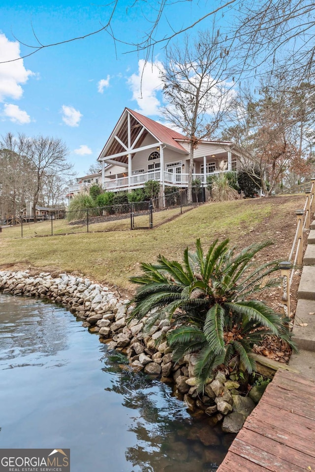 back of property featuring a yard