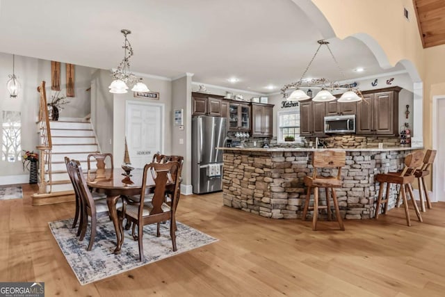 dining room featuring a chandelier and light hardwood / wood-style flooring