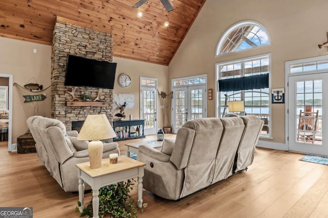 living room with ceiling fan, wood ceiling, french doors, and high vaulted ceiling