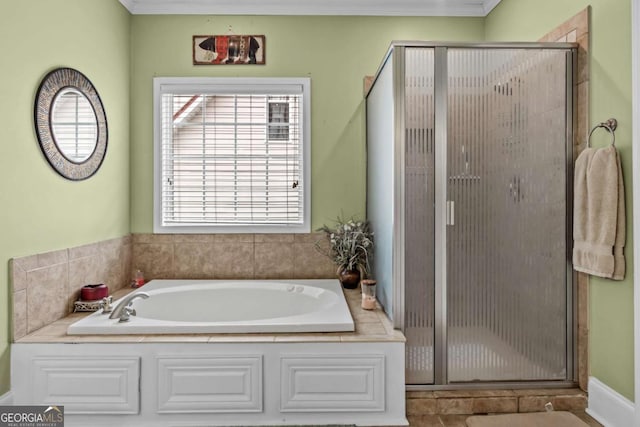 bathroom featuring crown molding and independent shower and bath