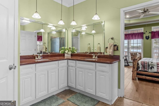 bathroom featuring ceiling fan, tile patterned flooring, crown molding, and vanity